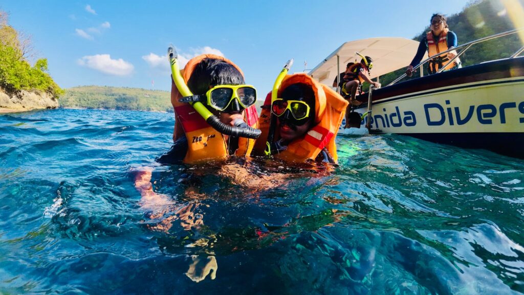 Multi-generational family snorkeling together in the Caribbean